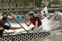 The Great River Race is expected to pass under Putney Bridge at midday