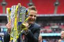 You beauty: Neal Ardley shows off his new best friend.....