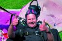 Thumbs up: Rev Andy Jacobson after his sky dive