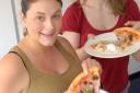Expecting mum Louise Johnson tries the pregnancy pizza with Diana Pilkington