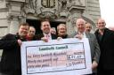 Lib Dem councillors protest outside the town hall