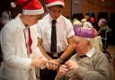 Pupils speak to elderly residents at their Christmas party