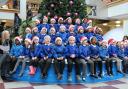 Youngsters sing for shoppers