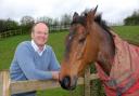 Grand National winner Pineau De Re with trainer Dr Richard Newland, who stopped practising as a GP