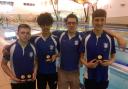 Medal charge: (from left to right) Dylan Conway, Blu Edmunds, coach Damien Bryan and Filip Blazevic