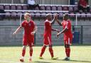 On the mark: Ex-Beaver Richard Pacquette, centre, celebrates a pre-season goal against Whyteleafe earlier in the summer