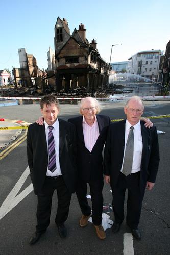 The Reeves family outside their Croydon furniture store which was razed to the ground.