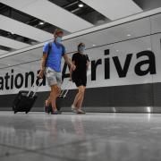 Passengers at Heathrow Arrivals