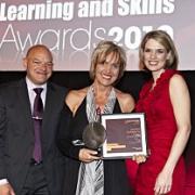 Barbara McNaughton receives her award for Best Small Employer 2010