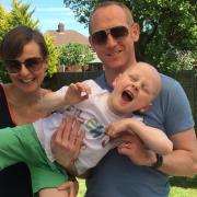 Parents Jenny and Steve with their son Lewis on the day they received the news he was in remission in June 2016