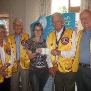 Sutton and Epsom Lions present last cheque to St Raph's
