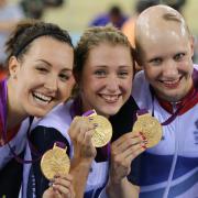 Laura Trott (centre) is first woman cyclist to win two Gold medals at a single Games for Team GB