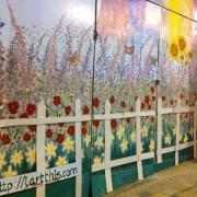 Community mural created in burnt-out fancy dress shop