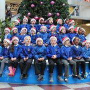 Youngsters sing for shoppers