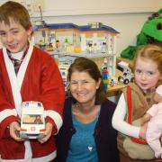 Harri and Hannah Griffiths with Jan Vance at The Children's Trust, in Tadworth