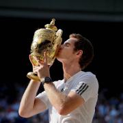 Hello you: Andy Murray gets acquainted with the Wimbledon Cup             Picture: Matthias Hangst / AELTC