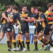 Happy days: Centre Jay Udo-Udoma, left, celebrates the try that gave Esher a 13-7 half time lead in Saturday’s win	  	Deadlinepix SP79128