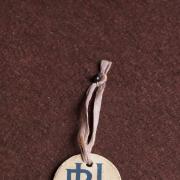 Blast From the Past: a cardboard badge worn by recruits from university and public schools