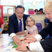 David Cameron asserts firm leadership over a jigsaw puzzle at Advantage Day Nursery