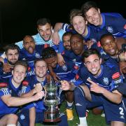 Tangible reward: Met Police players celebrate winning the Surrey Senior Cup for the first time in the club's history    Picture: Andy Nunn