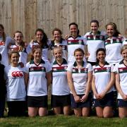 Welcome home: Stephanie Addison, front row second from right, with Surbiton's 2011 England Hockey U18 Cup winning squad