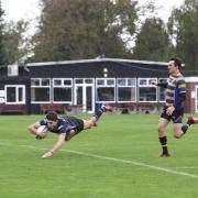Flying man: Olly Rathbone gets over the whitewash for Old Mid-Whitgiftian                 Pictures: SP93996