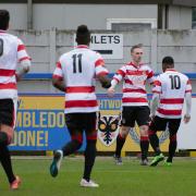 Simple: Kingstonian defender George Wells celebrates scoring direct from a corner against Grays Athletic