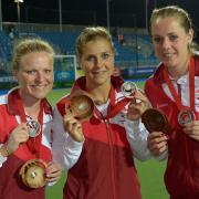 On the plane: Surbiton's Hollie Webb, Georgie Twigg and Giselle Ansley are hungry for more Olympic success