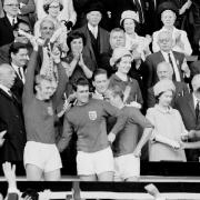 England Captain Bobby Moore holds aloft the Jules Rimet Trophy, followed by hat-trick hero Geoff Hurst, Bobby Charlton and Roger Hunt (PA Photo/Empics)