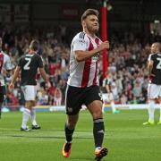 Back in the groove: Brentford striker Scott Hogan, who has scored eight goals in his past eight league appearances for the club, celebrates on Tuesday
