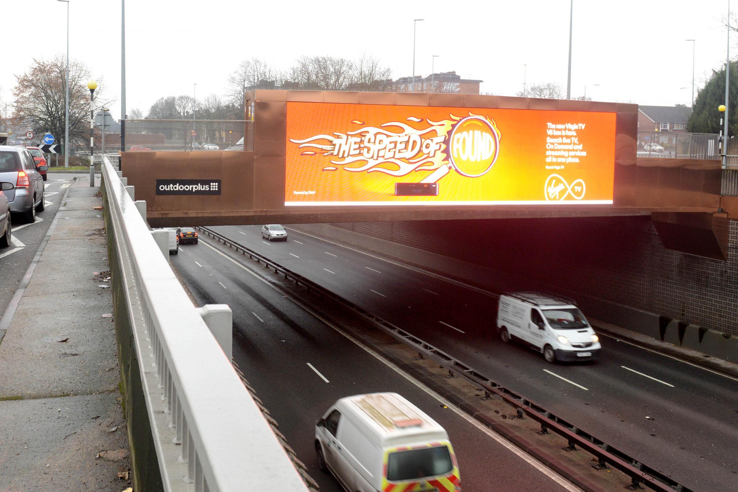 Incensed motorist slams New Malden's 'Las Vegas all-singing, all-dancing' billboard over the A3 for 'distracting' drivers