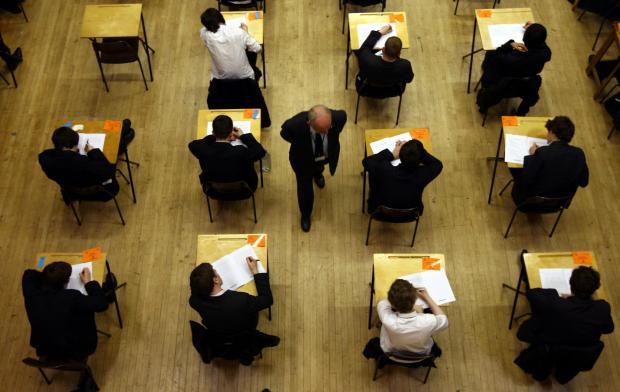 MPs warn of falling school standards amid savings drive 'delusion'