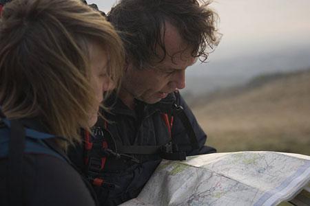 Ann Daniels, the chief navigator for the expedition, practice map reading skills with Pen Hadow. Picture: Martin Hartley