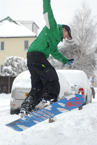Gareth Calvert used the oppurtunity to practice his snowboarding skills on his doorstep in Raynes Park... Picture: Gareth Harmer