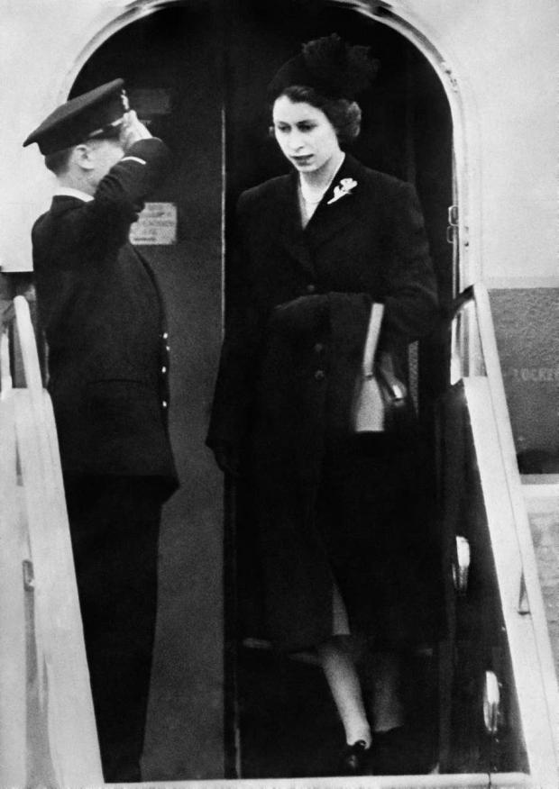 Your Local Guardian: The Queen sets foot on British soil for the first time since her accession as she lands at London Airport following the death of George VI (PA)