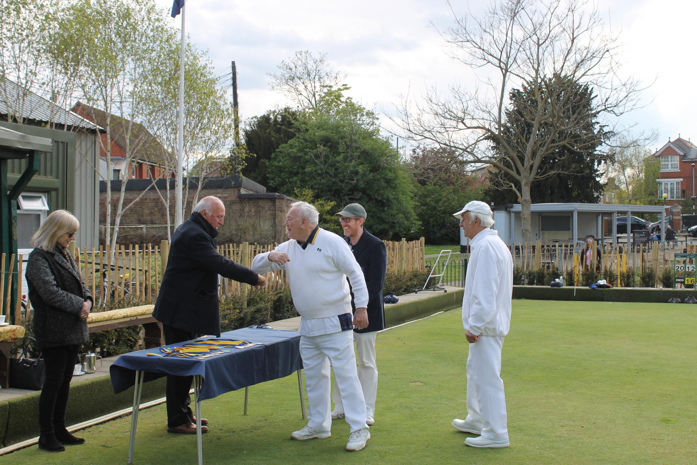 Strawberry Hill Bowling Club members receiving medals 