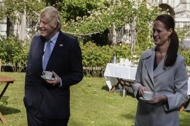 Jenny McGee with the prime minster at a Downing Street garden party last summer after helping treat him in hospital.