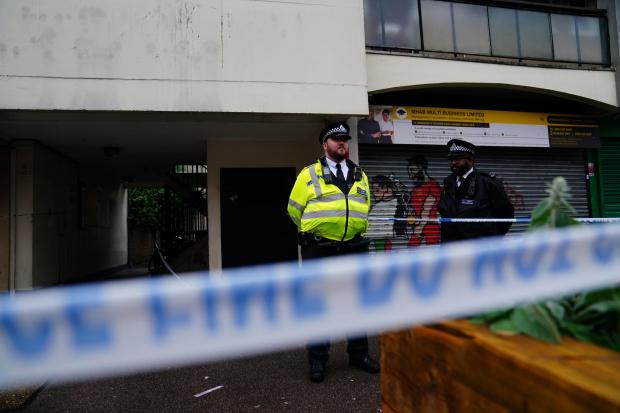 Police at the scene in Oval Place, Lambeth, south London, Victoria Jones/PA Wire