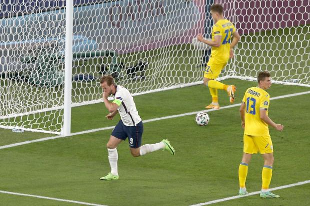 Harry Kane celebrates after scoring against Ukraine