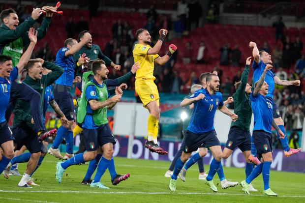 Italy celebrate their penaly shoot-out win against Spain in the semi finals.