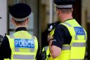 Man, 18, arrested over NINE crimes in Epsom High Street spree
