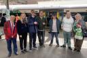 Passengers at Sutton Station following the free launch of the Aira app