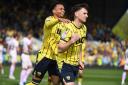 Josh Murphy and Mark Harris celebrate the latter giving Oxford United the lead from the penalty spot last month