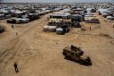 Kurdish forces patrol al-Hol camp, which houses families of members of the Islamic State group in Hasakeh province, Syria (Baderkhan Ahmad/AP)