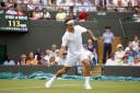In his way: Former world number one Roger Federer stands between Marcus Willis and a place in the third round at the Wimbledon Championships