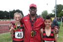 Winning team: Herne Hill Harriers coach flanked by Maisie Collis and Jaden Kennedy