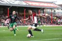 Crossing the divide: Brentford captain Jake Bidwell has joined QPR