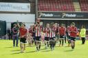 Lap of honour: Brentford players thank the fans for their support at Griffin Park this season