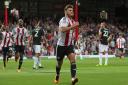 Back in the groove: Brentford striker Scott Hogan, who has scored eight goals in his past eight league appearances for the club, celebrates on Tuesday