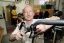 Helping hands: Martin Gale fixes bikes for the Eco-op, working around the problems using